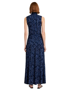 Woman wearing a sleeveless blue floral dress on a white background